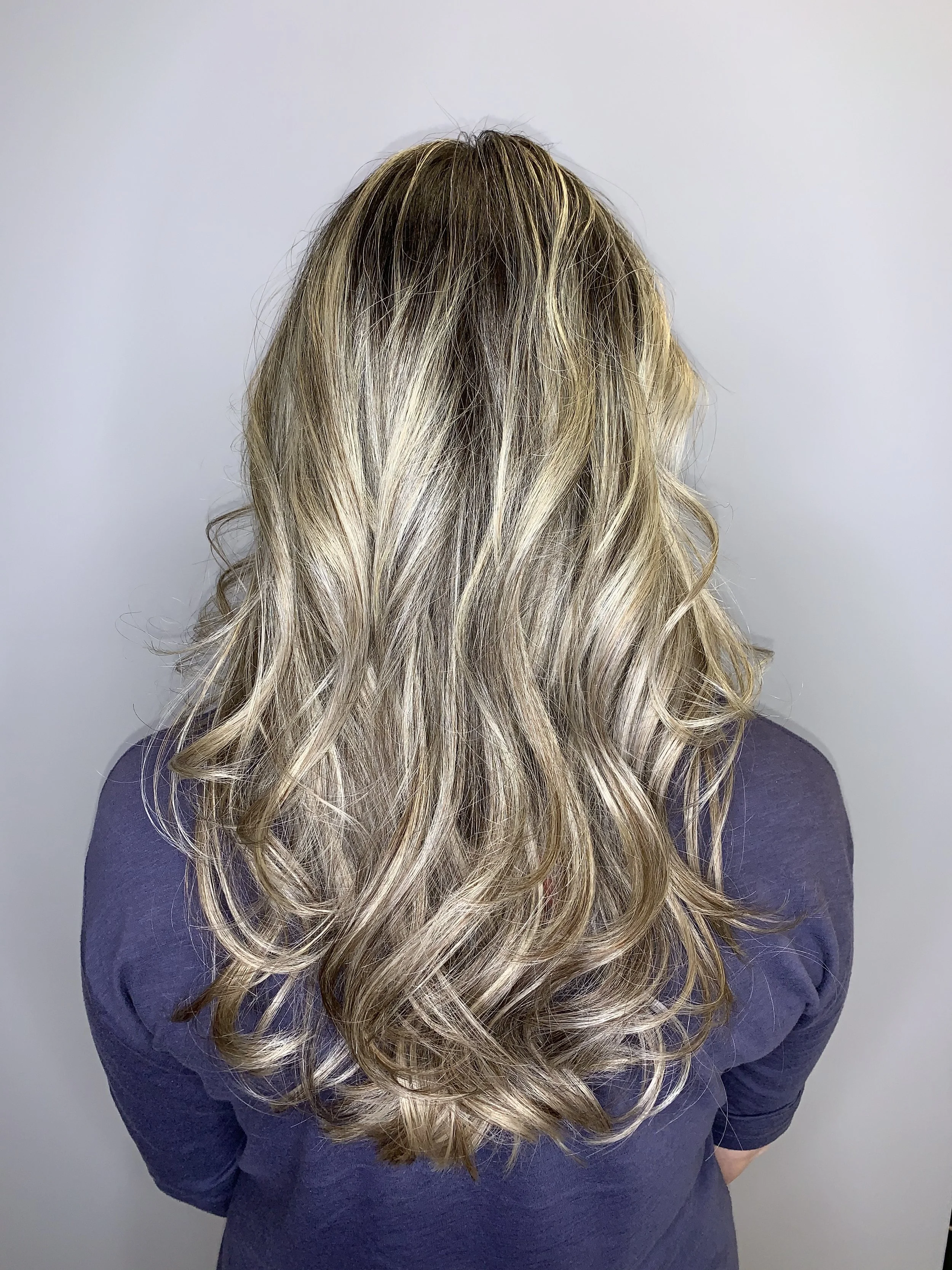 Blonde balayage with soft curls